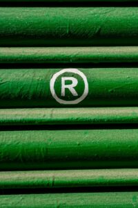 Close-up of green shutter with registered trademark symbol in white.